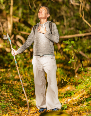 Person hiking in the forest experiencing calm and presence, representing the mindfulness benefits of Good Friday Wellness Psilocybin Magic Mushrooms.
