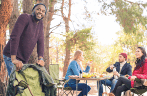 Forest picnic with friends enjoying food and laughter — Good Friday Wellness magic mushroom capsules lifestyle