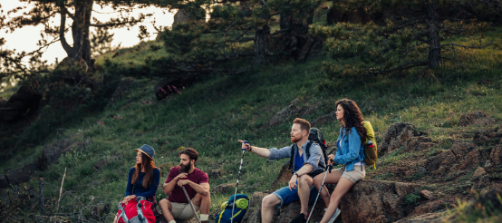 Group of hikers pausing for reflection aided by Good Friday Wellness magic mushroom capsules