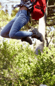 Hiker jumping with joy and energy after Good Friday Wellness magic mushroom capsules