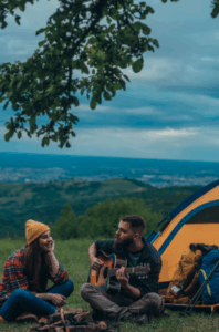 Couple by a tent with a man playing guitar at sunset – Good Friday Wellness Psilocybin Magic Mushrooms